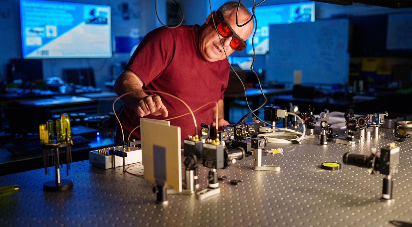 Brian Rashap, CNM Quantum Learning Lab (QuLL) lead, setting up the experimental capability for a QuLL learning module.
